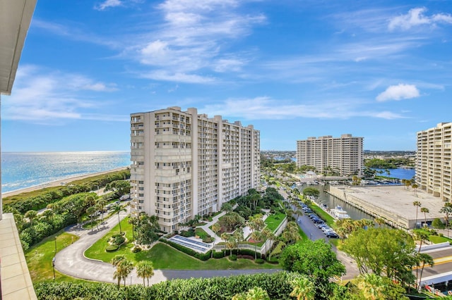 aerial view with a water view and a view of the beach