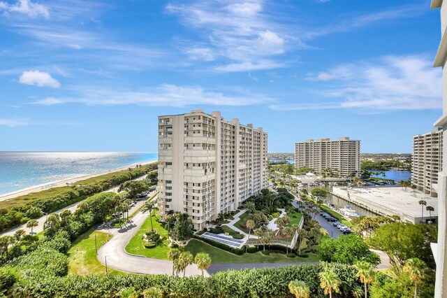 birds eye view of property featuring a water view and a view of the beach