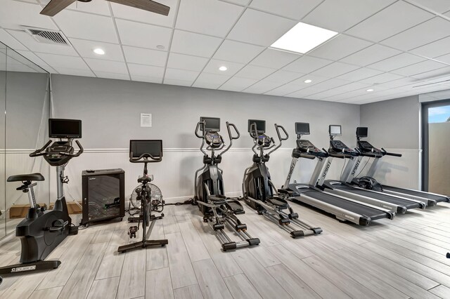 exercise room with a paneled ceiling