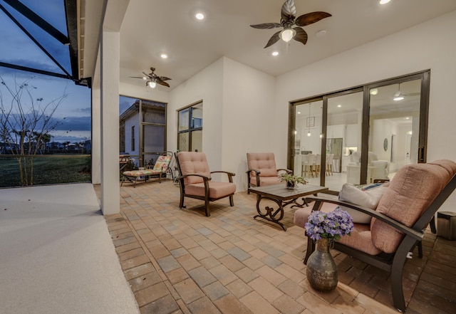 view of patio / terrace with glass enclosure and ceiling fan