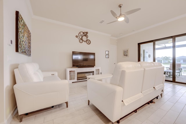 living room with ceiling fan and crown molding