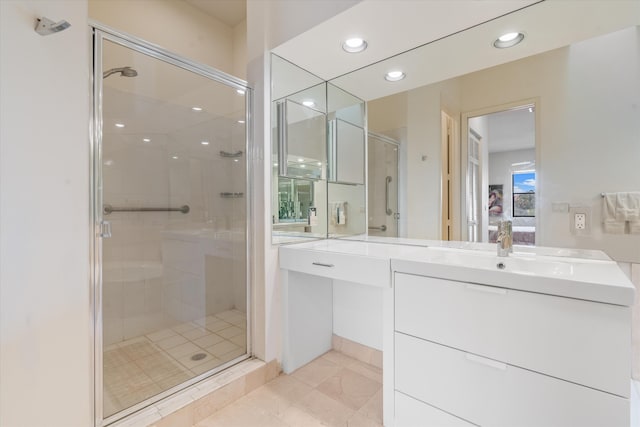 bathroom featuring tile patterned floors, vanity, and an enclosed shower