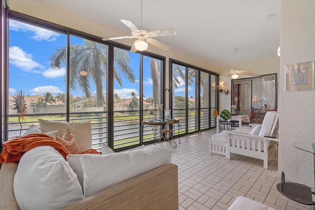 sunroom / solarium with ceiling fan