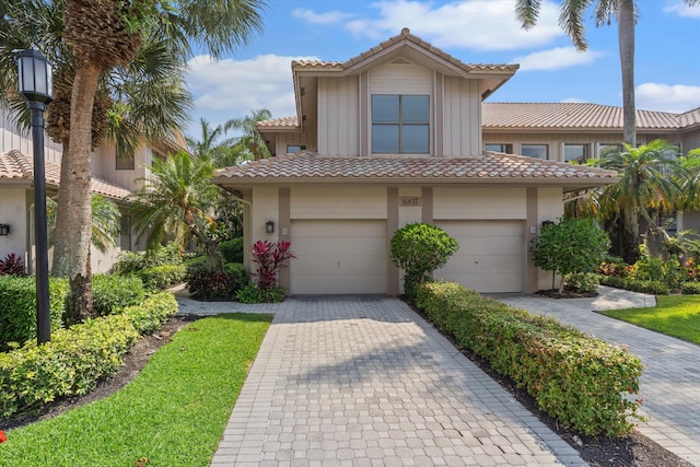 mediterranean / spanish-style home featuring a garage