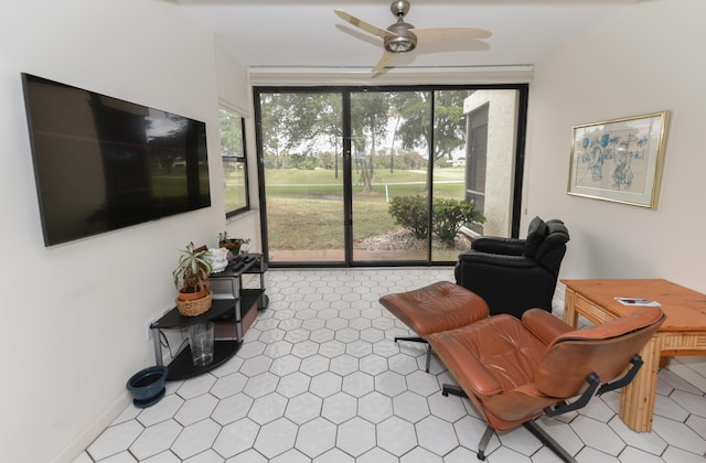 sitting room with ceiling fan