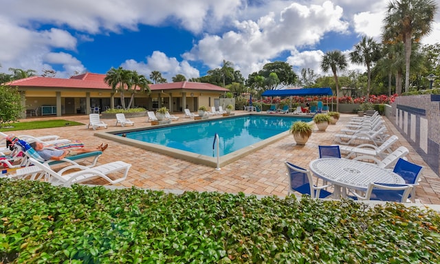 view of swimming pool with a patio