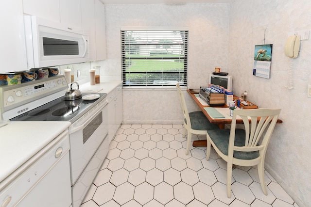 kitchen with white cabinets and white appliances