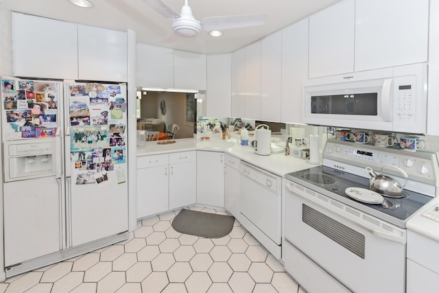 kitchen with ceiling fan, sink, white cabinets, and white appliances