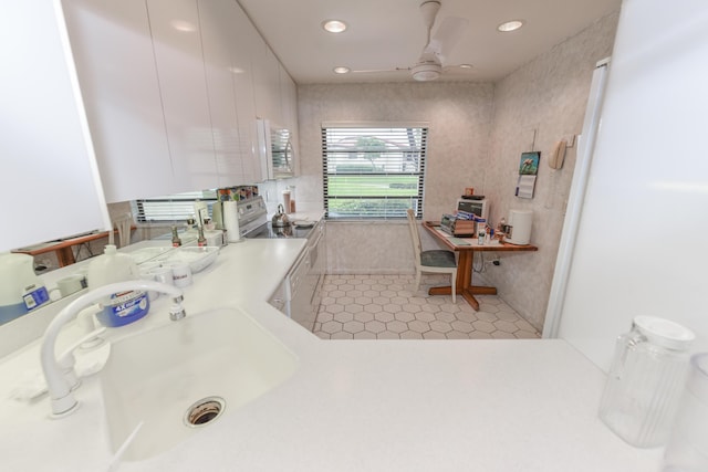 bathroom with tile patterned floors, ceiling fan, and sink