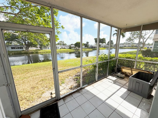 sunroom with a water view