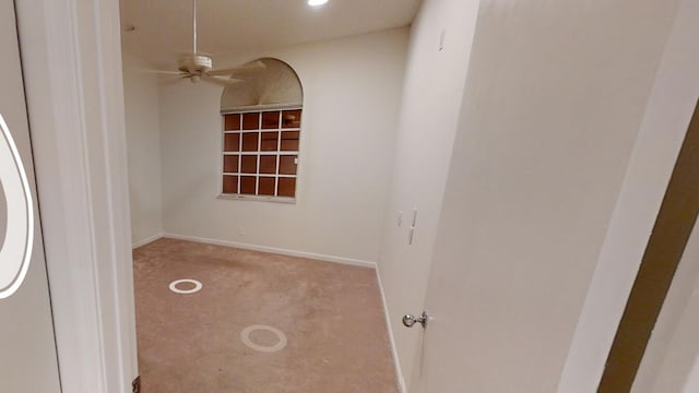 unfurnished room with light carpet and ceiling fan