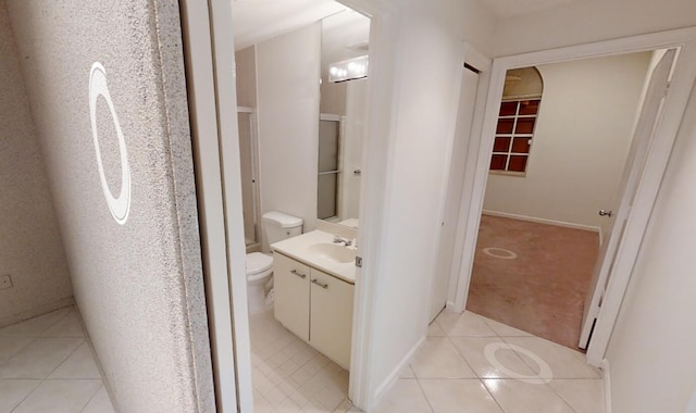 bathroom with tile patterned floors, vanity, and toilet