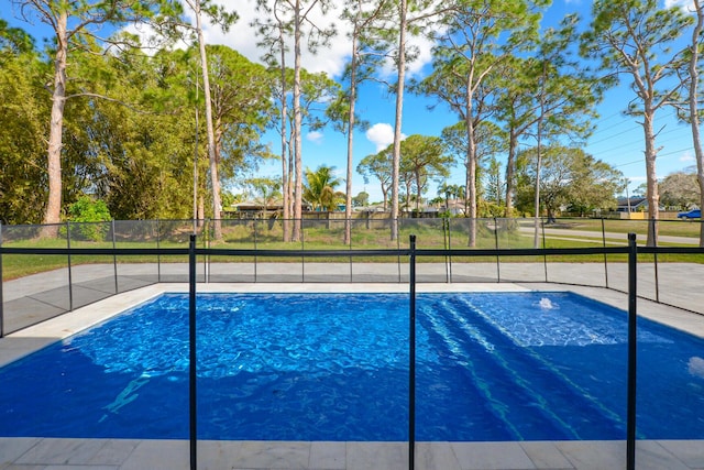 exterior space with fence and a fenced in pool