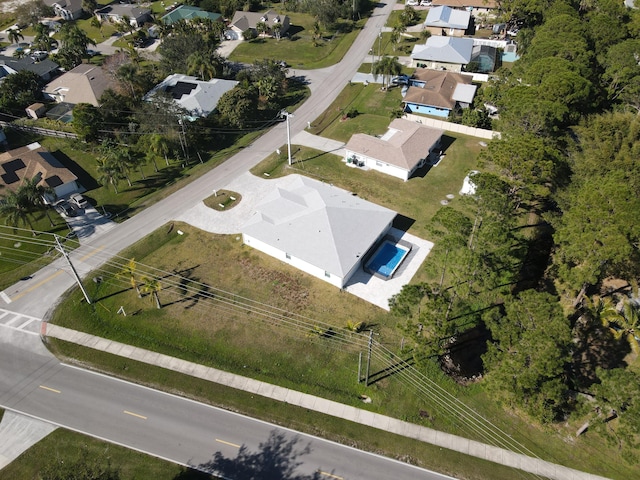 birds eye view of property with a residential view