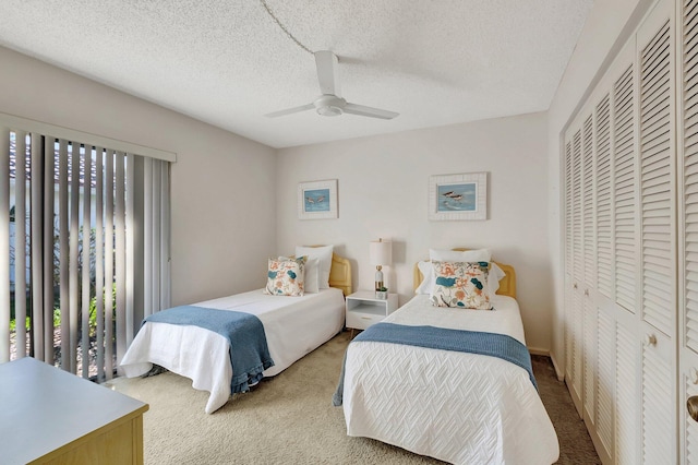 bedroom with a textured ceiling, ceiling fan, access to exterior, and light carpet