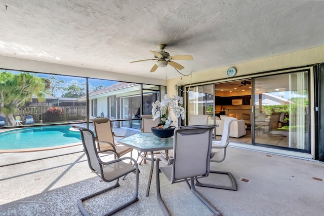 sunroom with ceiling fan and a healthy amount of sunlight