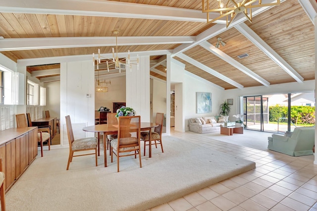 dining area with beam ceiling, an inviting chandelier, high vaulted ceiling, and tile patterned floors