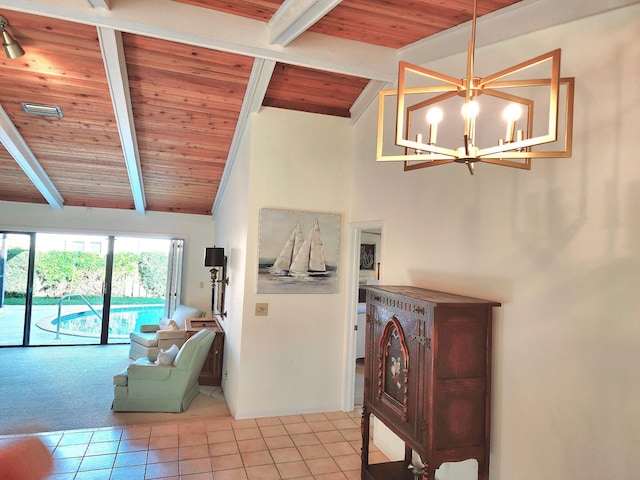 living room with beamed ceiling, wooden ceiling, light tile patterned floors, and a chandelier