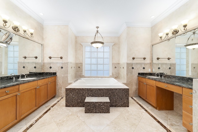 bathroom with vanity, tiled bath, tile walls, and crown molding