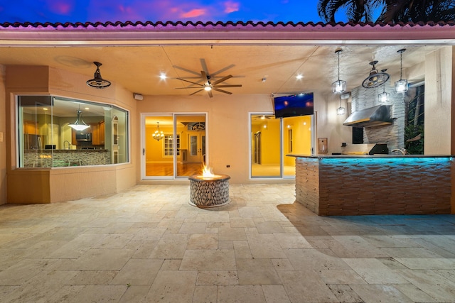 patio terrace at dusk with ceiling fan