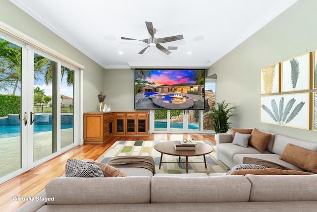 living room featuring ceiling fan, light hardwood / wood-style floors, crown molding, and french doors