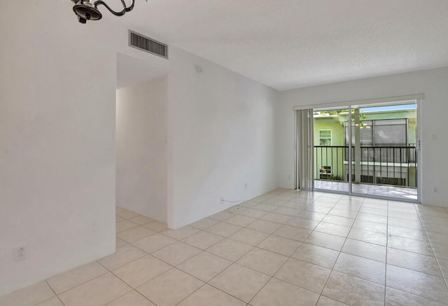 view of tiled spare room