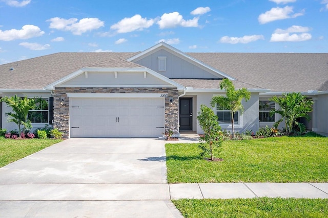 view of front of property featuring a garage and a front lawn