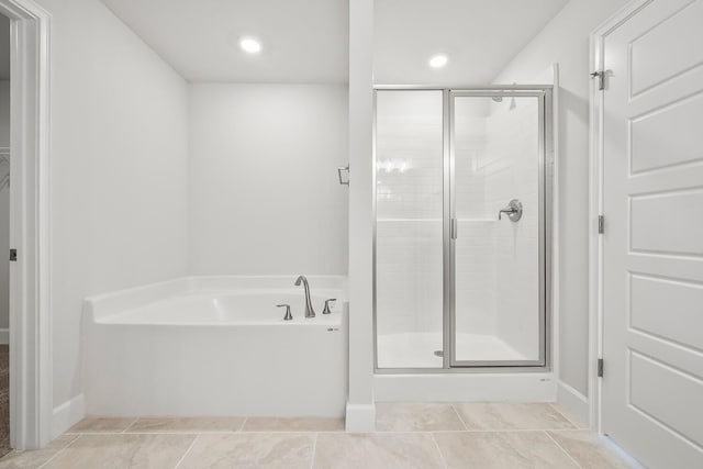 bathroom featuring tile patterned floors and plus walk in shower