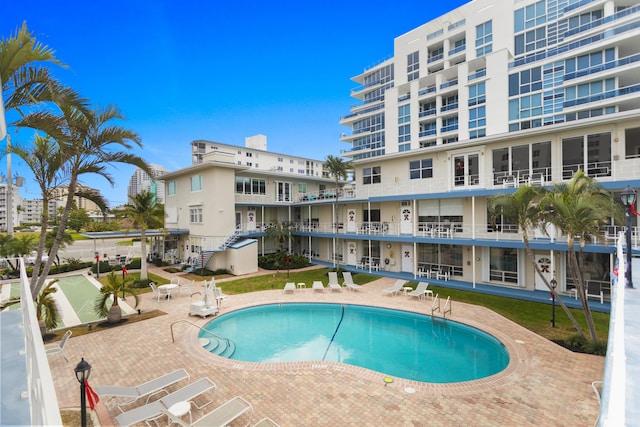 view of swimming pool with a patio