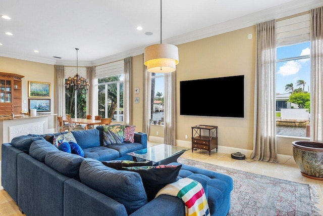 tiled living room with plenty of natural light, crown molding, and a chandelier