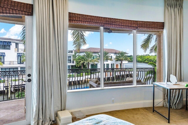 791 NE Marine Dr, Boca Raton, FL 33431 - doorway to outside featuring baseboards