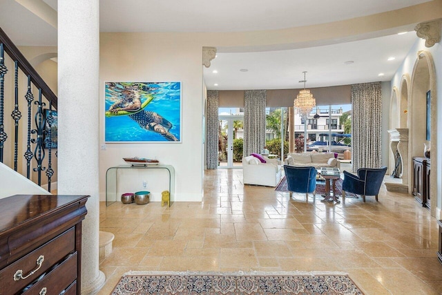 791 NE Marine Dr, Boca Raton, FL 33431 - foyer entrance featuring stone tile floors, recessed lighting, baseboards, and a chandelier