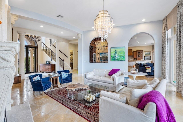 791 NE Marine Dr, Boca Raton, FL 33431 - living room with arched walkways, recessed lighting, stairway, a chandelier, and stone tile flooring