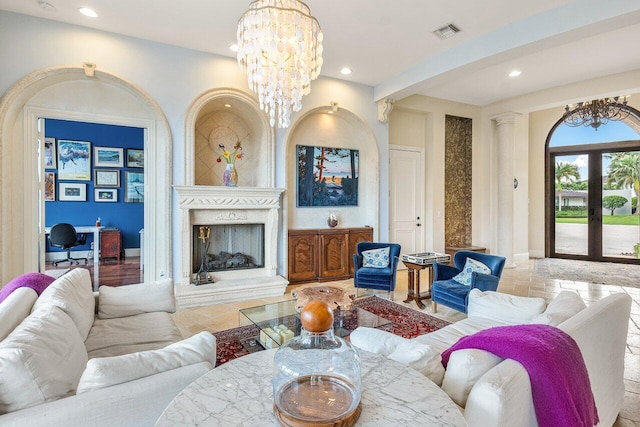 791 NE Marine Dr, Boca Raton, FL 33431 - living room featuring recessed lighting, a chandelier, a high end fireplace, and stone tile flooring