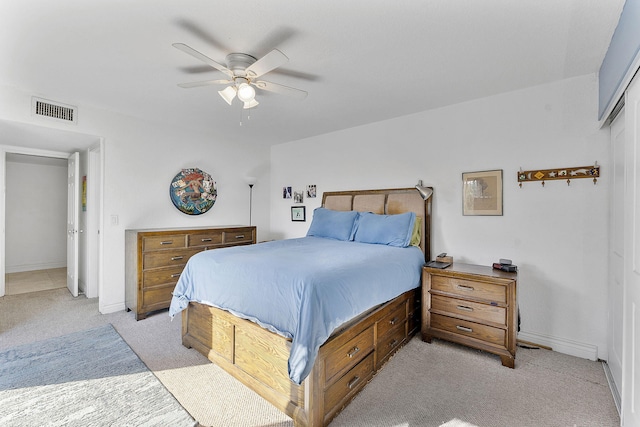 carpeted bedroom with ceiling fan