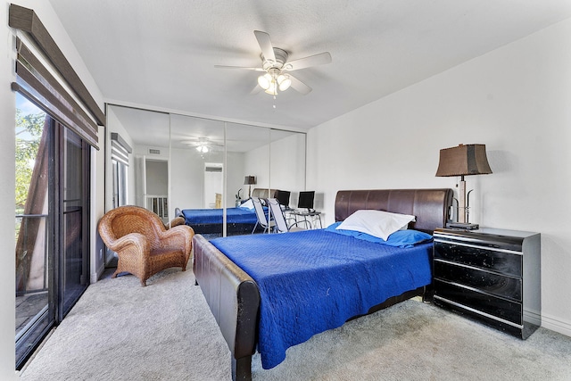 bedroom featuring a closet, ceiling fan, and light colored carpet