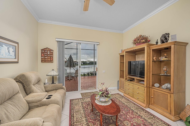 living room with light tile patterned floors, a textured ceiling, ceiling fan, and crown molding