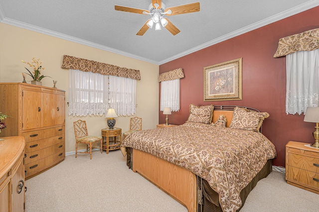 bedroom featuring a textured ceiling, light colored carpet, ceiling fan, and crown molding