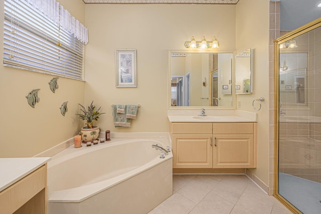 bathroom featuring tile patterned flooring, vanity, and independent shower and bath