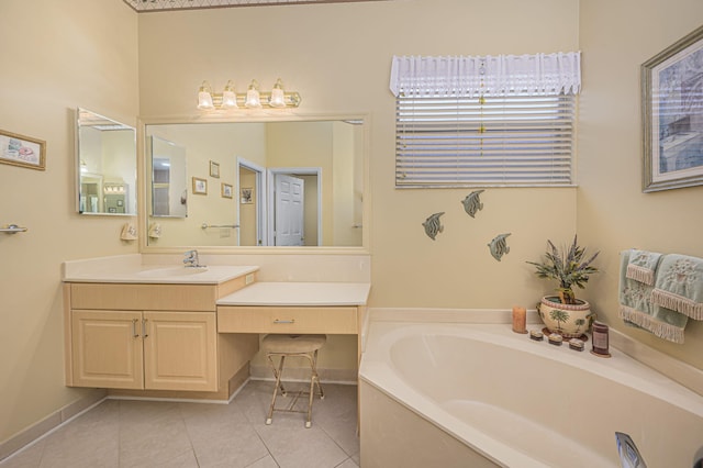 bathroom with tile patterned flooring, vanity, and a tub