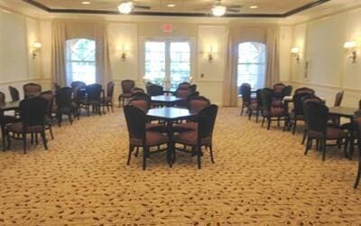 dining room featuring a raised ceiling and ornamental molding