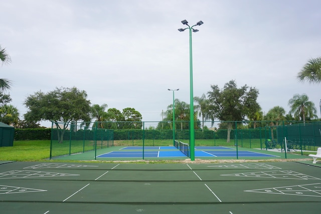 view of sport court featuring tennis court