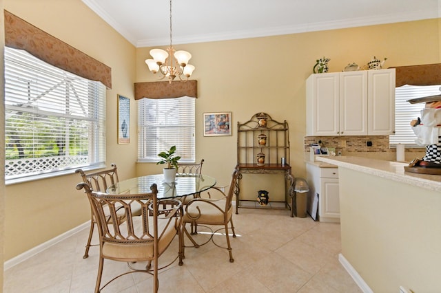 dining space with ornamental molding, a chandelier, and light tile patterned floors