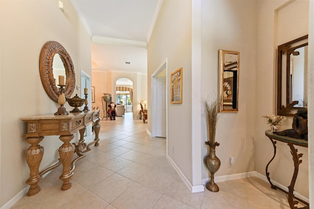 corridor with ornamental molding and light tile patterned floors