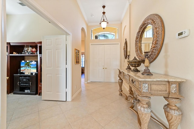 tiled entryway with ornamental molding