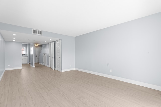 unfurnished room featuring light hardwood / wood-style floors