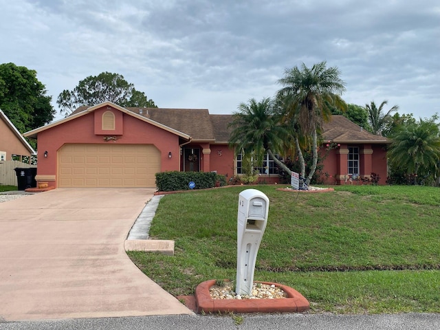 single story home with a front yard and a garage