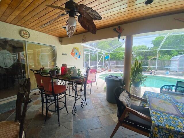 view of patio / terrace featuring a fenced in pool and a lanai