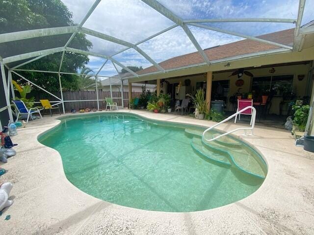 view of pool with a lanai and a patio area