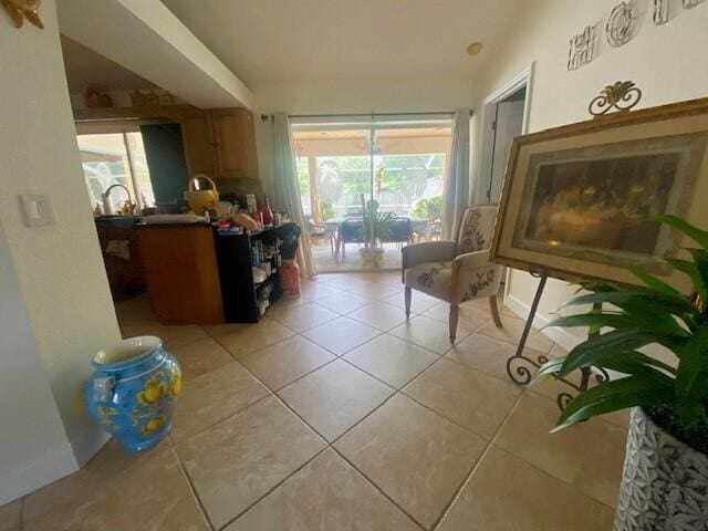 interior space with plenty of natural light and light tile patterned flooring